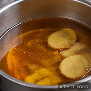 Ginger syrup gently warming in a saucepan