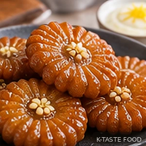 Golden glazed Korean yakgwa served with yuja yogurt cream