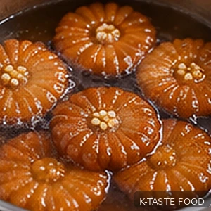 Fried Korean yakgwa cookies soaking in ginger rice syrup