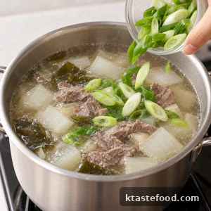 Fresh green onions added to the finished Korean beef radish soup